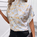 Clasi Blusa elegante para mujer con base azul, mangas murcielago dorado estampado, pequeno cuello alto con lazo en la espalda