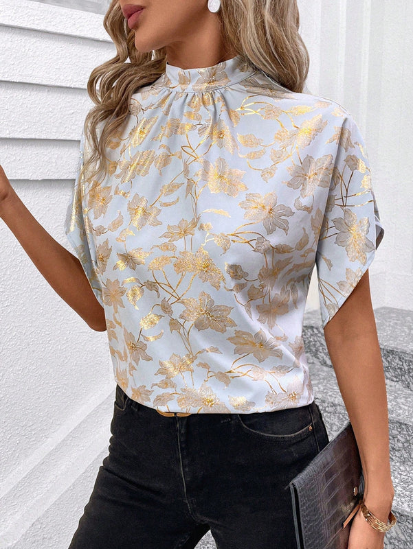 Clasi Blusa elegante para mujer con base azul, mangas murcielago dorado estampado, pequeno cuello alto con lazo en la espalda