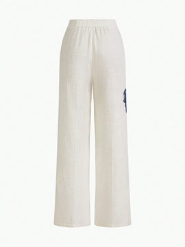 Motf premium pantalones de bolsillo inclinado con estampado floral y costura frontal