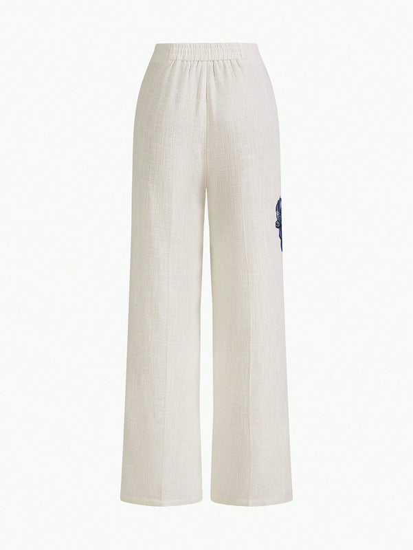 Motf premium pantalones de bolsillo inclinado con estampado floral y costura frontal
