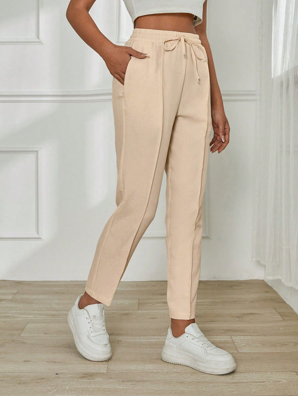 Pantalones casuales para mujer con cintura elastica con cordon, ajuste regular y bolsillos inclinados de unicolor