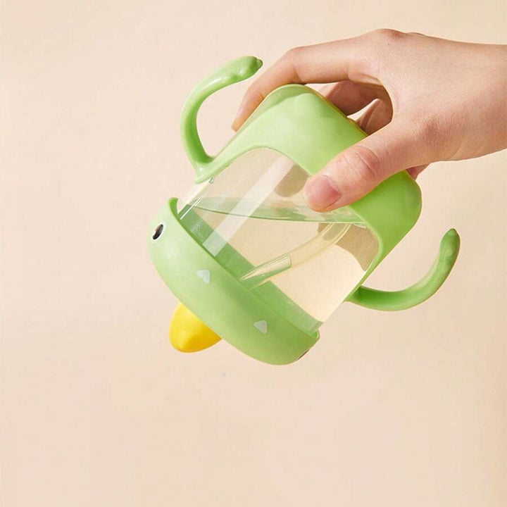 VASO ENTRENADOR PARA BEBÉ CON DISEÑO DE DINOSAURIO 300ML 35157-9 MUNBE