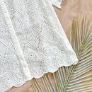 Camisa blanca suelta para mujeres con bordado de textura y patron floral quemado, adecuada para vacaciones, playa, temporada de graduacion, fiesta de Pascua, almuerzo y salidas de te por la tarde