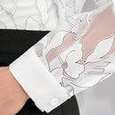 Blusa elegante de manga larga transparente estampada con flores para el verano