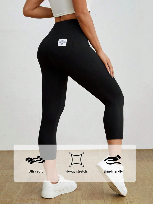 PETITE Mallas negras informales y elasticas para mujeres con detalles de etiqueta en la parte trasera