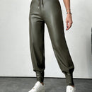 Pantalones con punos elasticos y cintura con cordon de color liso para mujer