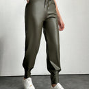 Pantalones con punos elasticos y cintura con cordon de color liso para mujer