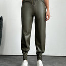 Pantalones con punos elasticos y cintura con cordon de color liso para mujer