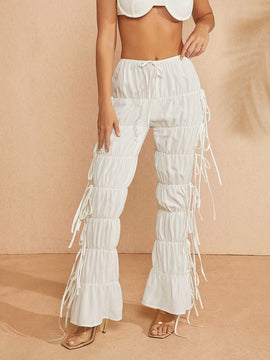 Haute Pantalones blancos con fruncidos, cintura con cordon y varios niveles