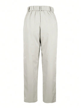 Pantalones largos casuales con botones y bolsillos de unicolor