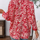 Camisa informal de manga larga para mujer con botones frontales y estampado completo con dobladillo asimetrico