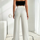 Pantalon palazzo de pierna ancha blanco con detalle de boton