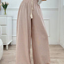 Pantalones boho anchos de vacaciones con bandas elasticas tejidas de rayas y cordon decorativo