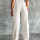 Pantalones altos de pierna ancha con pliegues