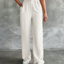 Pantalones altos de pierna ancha con pliegues