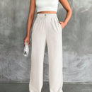 Pantalones altos de pierna ancha con pliegues