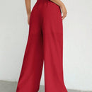 Pantalones sueltos de pierna ancha de color solido para mujer con dobladillo fluido, estilo casual