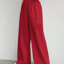 Pantalones sueltos de pierna ancha de color solido para mujer con dobladillo fluido, estilo casual