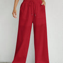 Pantalones sueltos de pierna ancha de color solido para mujer con dobladillo fluido, estilo casual