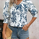 Camisa de media manga suelta con cuello en V y estampado floral para mujer para vacaciones de verano