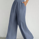 Pantalones sueltos de pierna ancha de color solido para mujer con dobladillo fluido, estilo casual