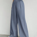 Pantalones sueltos de pierna ancha de color solido para mujer con dobladillo fluido, estilo casual