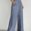 Pantalones sueltos de pierna ancha de color solido para mujer con dobladillo fluido, estilo casual