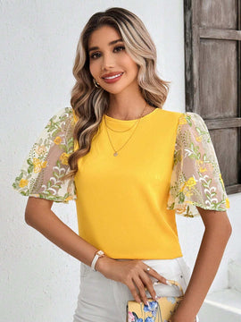 Blusa elegante amarilla de manga con volantes y bordados para damas