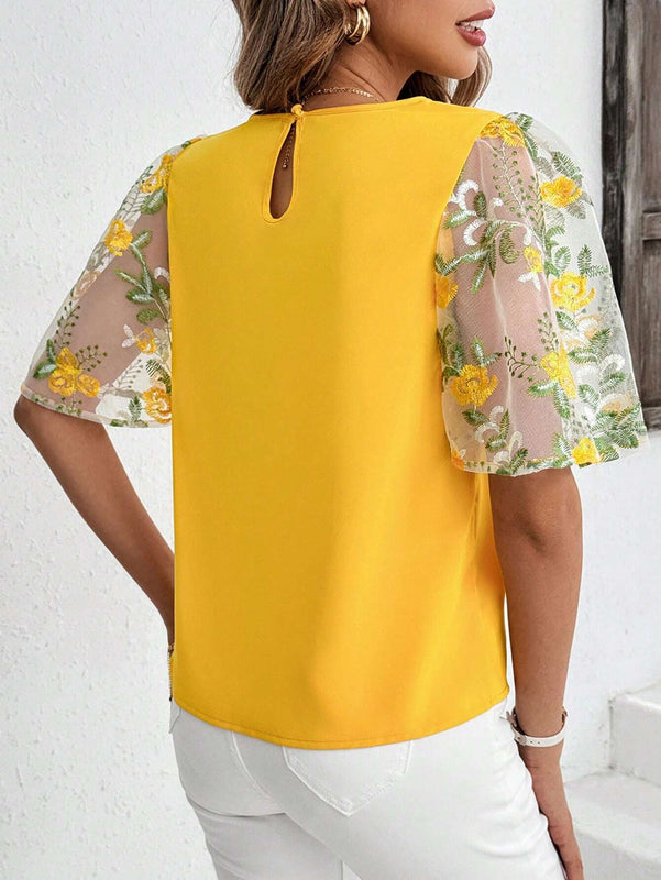 Blusa elegante amarilla de manga con volantes y bordados para damas