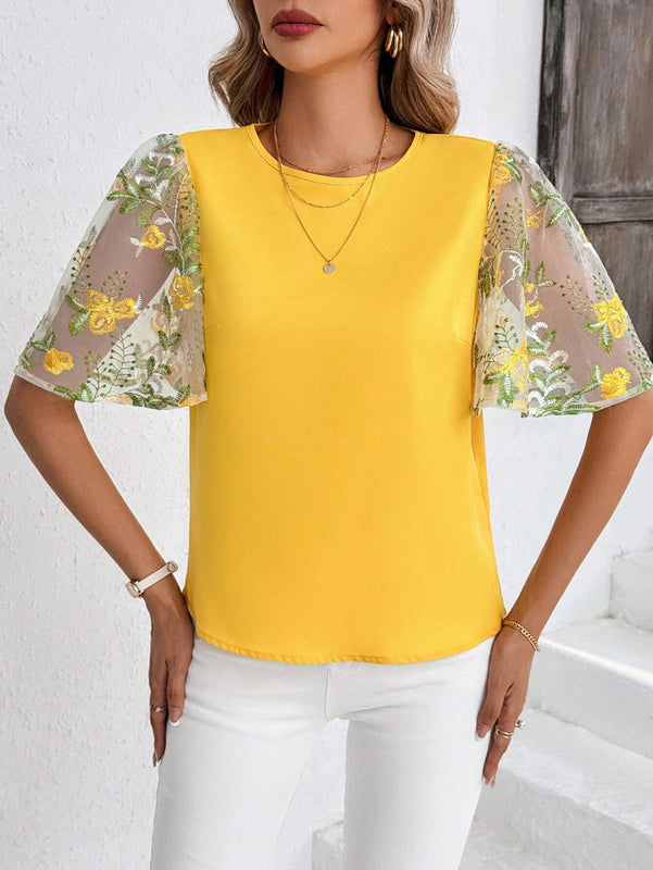 Blusa elegante amarilla de manga con volantes y bordados para damas
