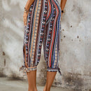 Lune pantalones con diseno geometrico y dobladillo dividido con nudo
