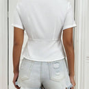 Blusa solida con frente de corbata