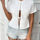 Blusa solida con frente de corbata