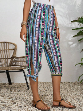 LUNE Pantalones con diseno geometrico y dobladillo dividido con nudo