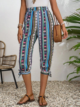 LUNE Pantalones con diseno geometrico y dobladillo dividido con nudo