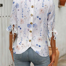 Blusa con estampado floral, botones en la parte posterior, nudo en los punos