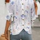 Blusa con estampado floral, botones en la parte posterior, nudo en los punos