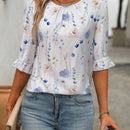 Blusa con estampado floral, botones en la parte posterior, nudo en los punos