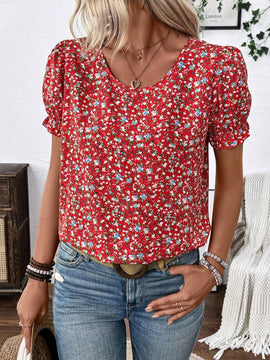 Camisa floreada de manga corta y holgada estilo vacacional con mangas abullonadas y cuello redondo