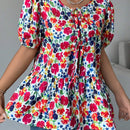 Blusa de manga abullonada con estampado floral y cuello de lazo