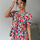 Blusa de manga abullonada con estampado floral y cuello de lazo