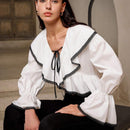 Camisa holgada para mujer con estilo chic y bloque de color adecuada para el trabajo y la conmutacion con dobladillo y punos de volantes