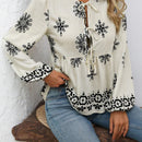 Blusa acampanada con cuello de lazo y mangas de linterna con estampado floral y volantes