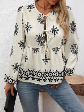 Blusa acampanada con cuello de lazo y mangas de linterna con estampado floral y volantes