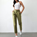 Pantalones largos de tela metalica con nudo frontal para mujer