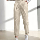 Pantalones largos de tela metalica con nudo frontal para mujer
