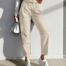 Pantalones largos de tela metalica con nudo frontal para mujer