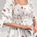 Blusa acampanada con mangas de volante y Body fruncido con estampado floral y cintura peplum