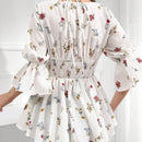 Blusa acampanada con mangas de volante y Body fruncido con estampado floral y cintura peplum