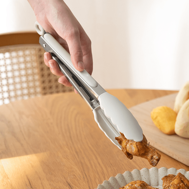 1pc Pinzas de Cocina de Silicona Premium - Resistentes al Alto Calor, Perfectas para BBQ, Sándwiches y Horneado - Acero Inoxidable Duradero con Mango Blanco Ergonómico - Herramienta de Cocina Esencial, Pinzas para Cocinar